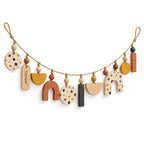 Doviquk™ Playful Boho Abstract Wooden Shapes Nursery Garland: front